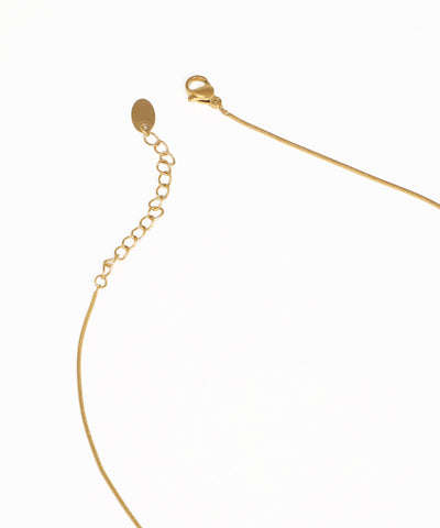 Gold abstract bar pendant necklace with contemporary minimalist styling