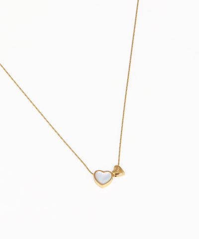 Delicate heart charm necklace with gold-tone chain and polished heart pendant