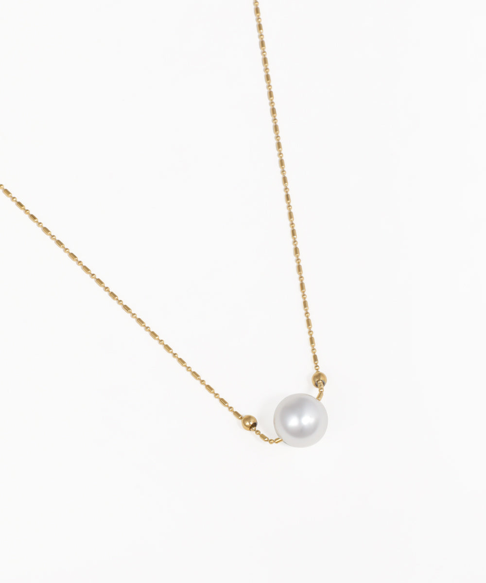 Delicate single pearl chain necklace with gold-tone chain and pearl pendant