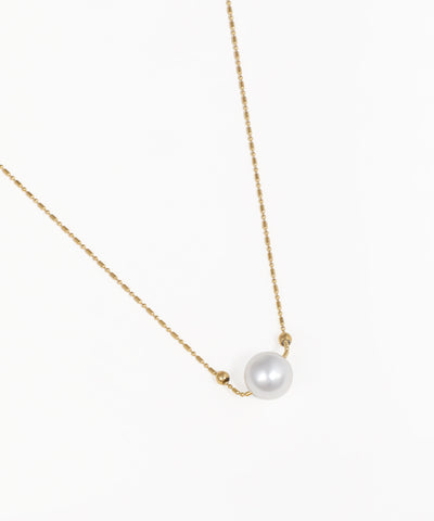 Delicate single pearl chain necklace with gold-tone chain and pearl pendant
