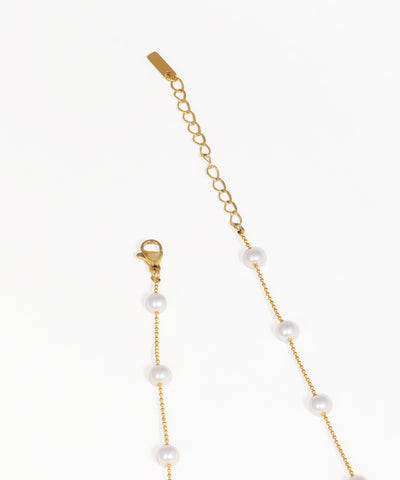 Gold beaded necklace with dangling crystal charms and fine chain