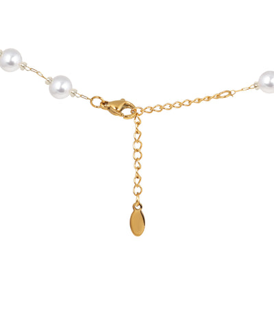 Minimal gold necklace featuring evenly spaced bead details