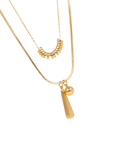 Layered gold necklace with geometric charms and bead accents