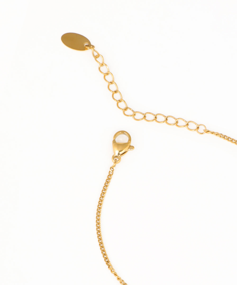 Dainty heart charm bracelet featuring two enamel heart pendants