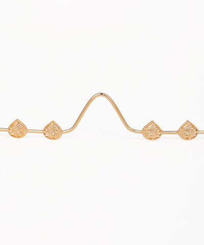Decorative gold facelet with openwork teardrop details and flowing lines