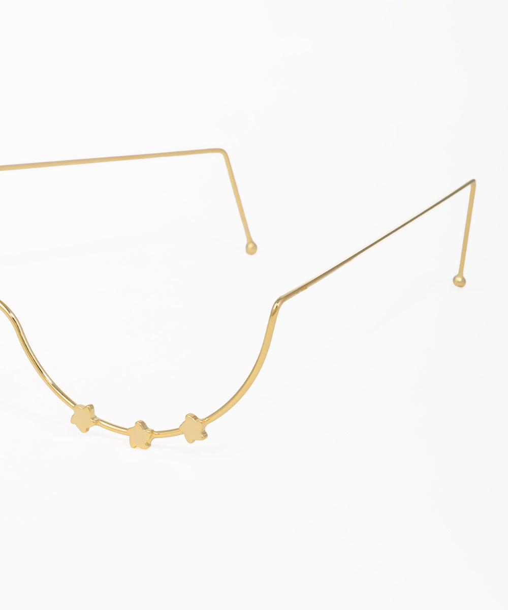 Delicate gold facelet featuring small star accents and a curved silhouette