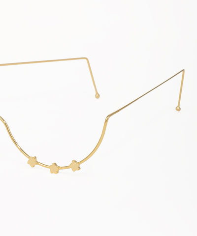 Delicate gold facelet featuring small star accents and a curved silhouette