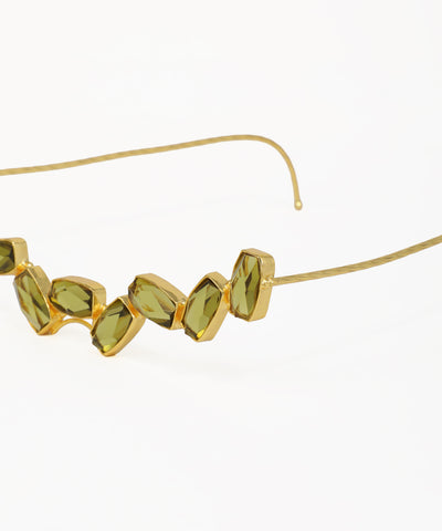 Elegant facelet with faceted olive-green gemstones and gold-tone detailing