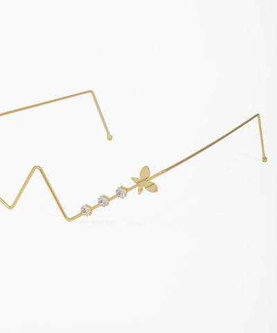 Modern zig-zag facelet with butterfly motifs and crystal accents