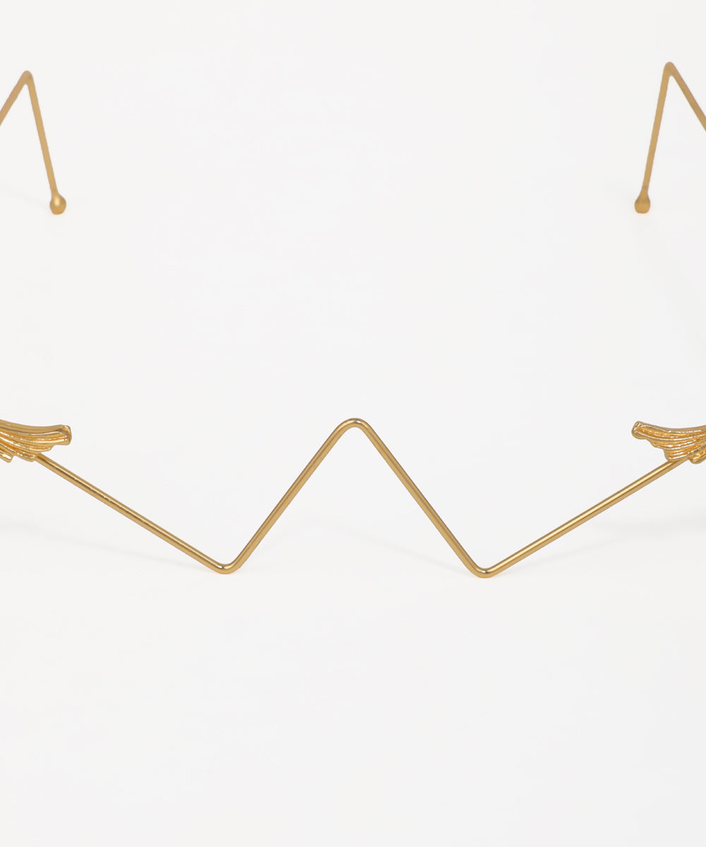 Elegant geometric facelet featuring ornamental bird accents and gold-tone wire