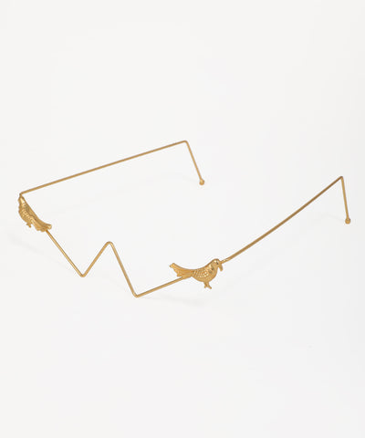 Statement facelet with artistic bird motifs and a gold zig-zag design