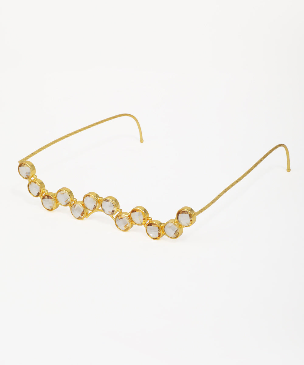 Decorative facelet with curved silhouette and round crystal details