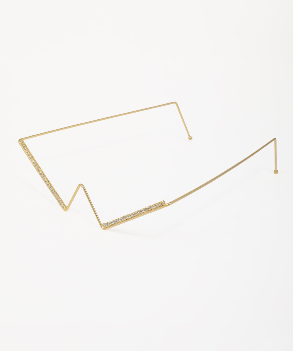 Statement geometric facelet featuring crystal-encrusted accents