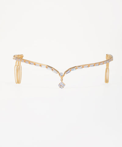 Gold and diamond bracelet on a white background
