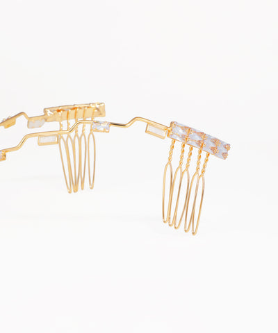 Elegant geometric headpiece with crystal accents and flowing wave pattern