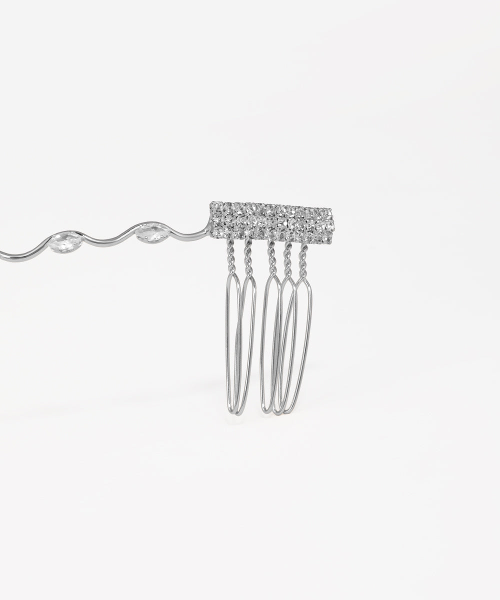 Silver bridal tiara adorned with crystal drops and wave-inspired design