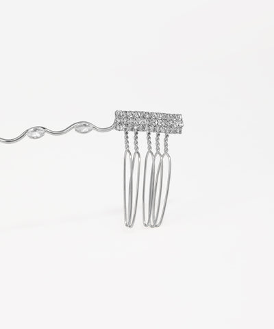 Silver bridal tiara adorned with crystal drops and wave-inspired design