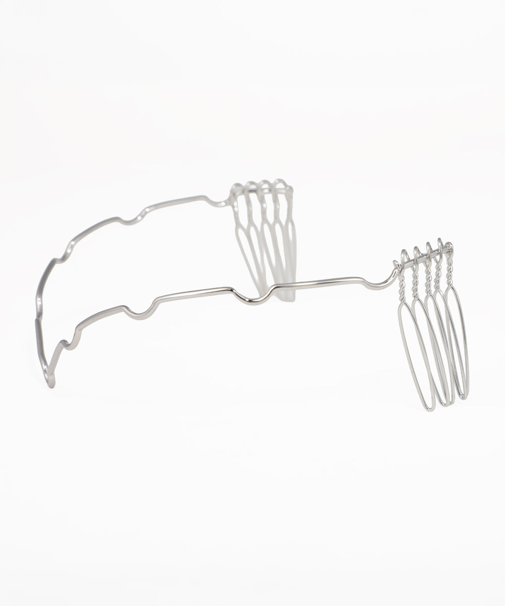 Minimalist silver-tone tiara headpiece with flowing wave silhouette