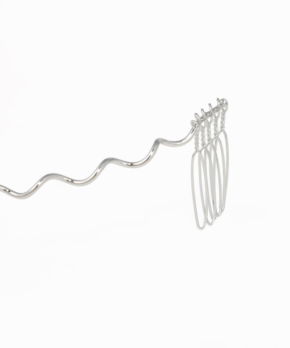Crystal hair headpiece featuring a flowing wavy silhouette