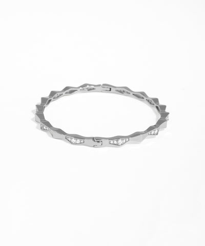 Silver ring with small diamonds on a white background