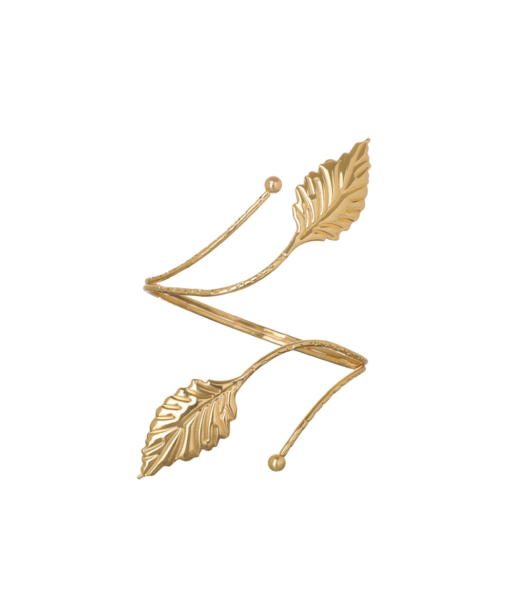 Gold-tone arm cuff with textured band and detailed leaf motifs at ends