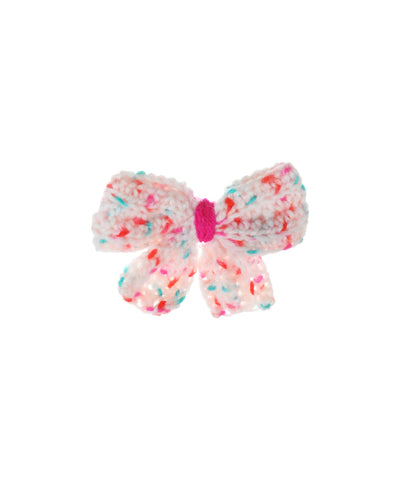 Pastel crochet hair clip with speckled confetti pattern and fuchsia center