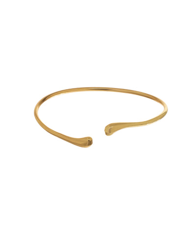 Gold-tone arm cuff with sleek open band design and subtly flared ends
