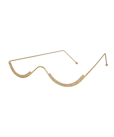 Gold-tone facelet with wavy design and sparkling clear stones