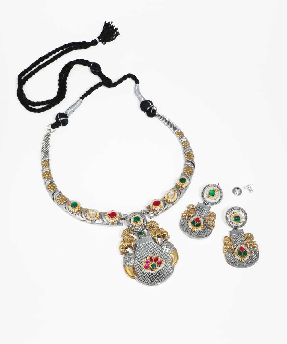 Oxidise silver-tone and gold-tone necklace set with temple motif pendant, lion figures, and colored stones