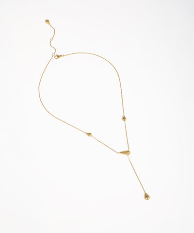 Gold-tone necklace with delicate chain and polished teardrop elements in a Y-drop design