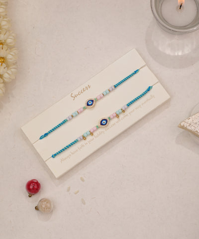 Gold-tone Rakhi set with evil eye charms and pastel beads
