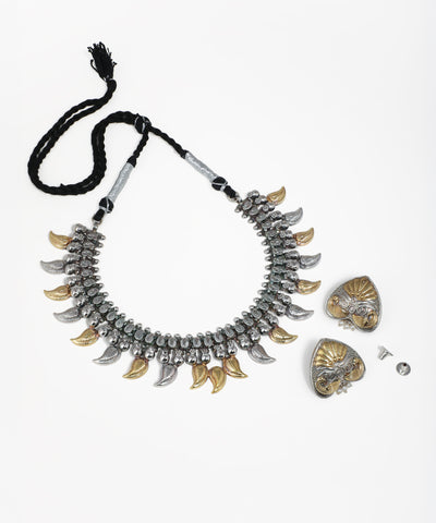 Oxidized silver-tone and gold-tone necklace set with leaf pendants and heart-shaped earrings