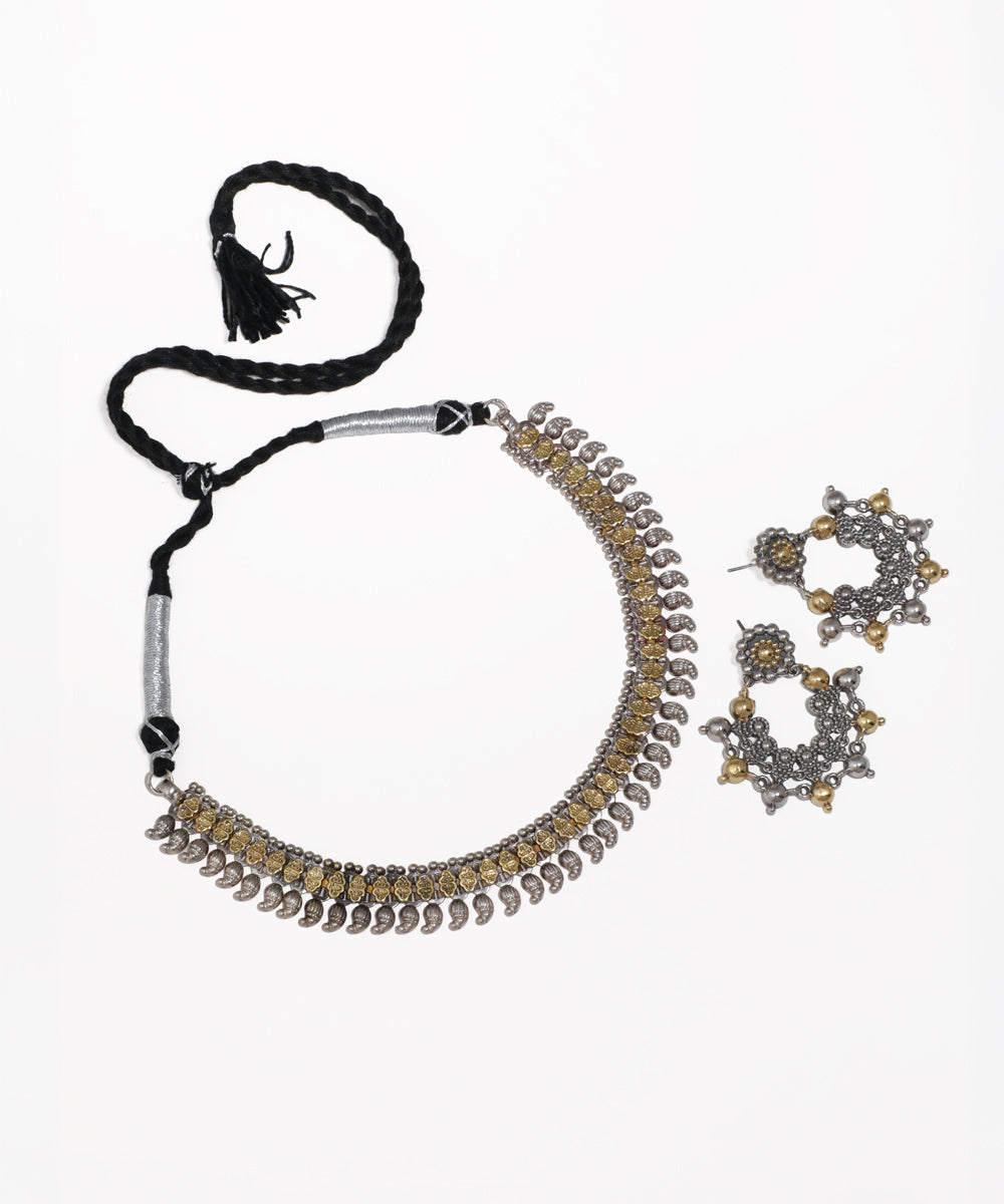 Oxidise finish dual tone necklace set with floral and paisley motifs, matching jhumka earrings