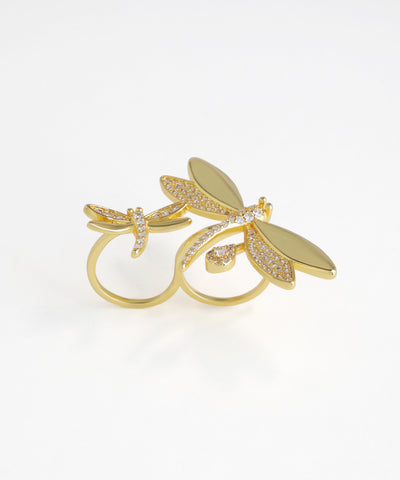Gold-tone double finger ring with two sparkling CZ dragonfly motifs.