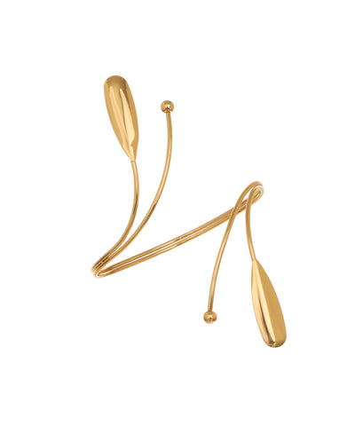 Gold-tone arm cuff with sleek, elongated capsule tips and minimalist wrap design