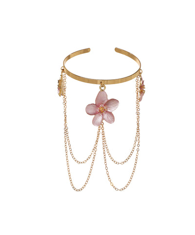Gold-tone arm cuff with pink floral charms and cascading chains