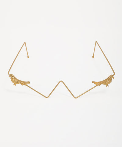 Gold-tone facelet with detailed bird motifs and geometric wire frame