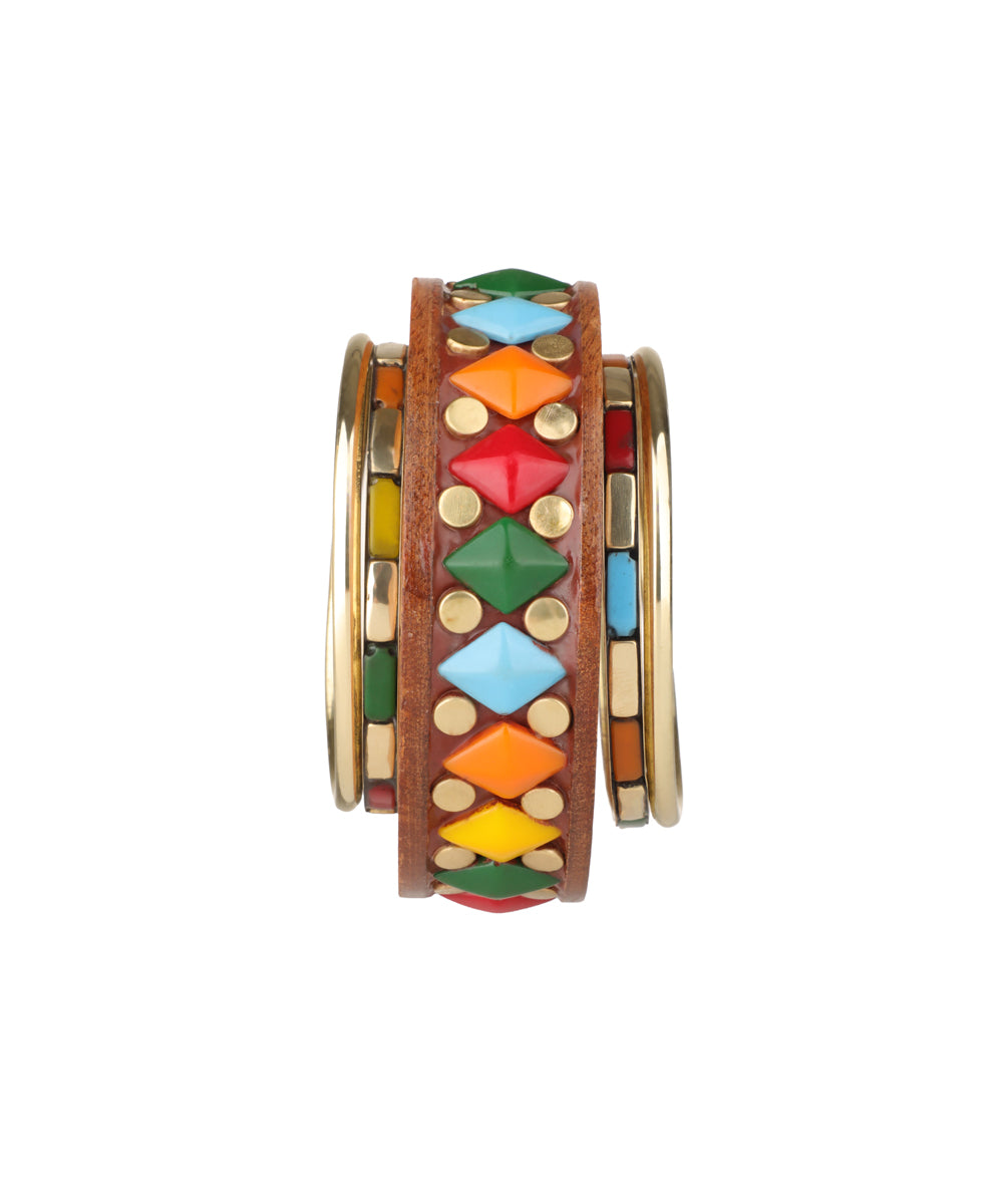 Brown wooden kada and gold-tone bangles with colorful pyramid studs and small gold dots