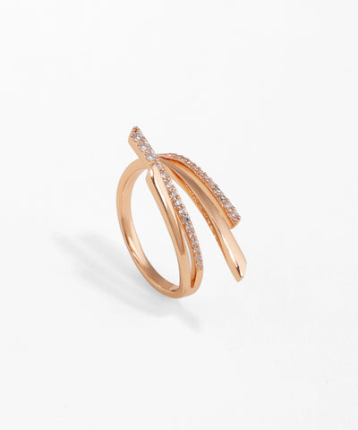 Rose-gold-tone ring with curved, layered crossover bands, some set with clear cubic zirconia stones.