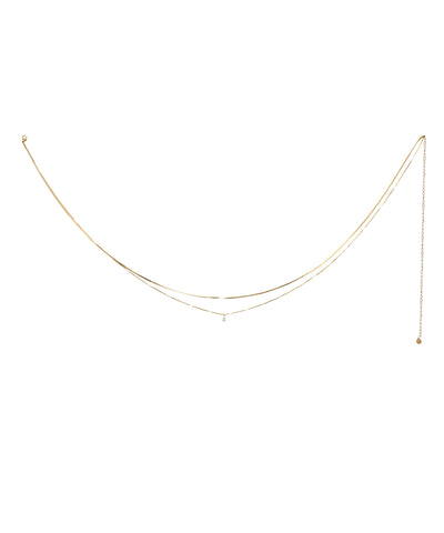 Gold-tone layered waist chain with a single cubic zirconia stone drop and adjustable extender