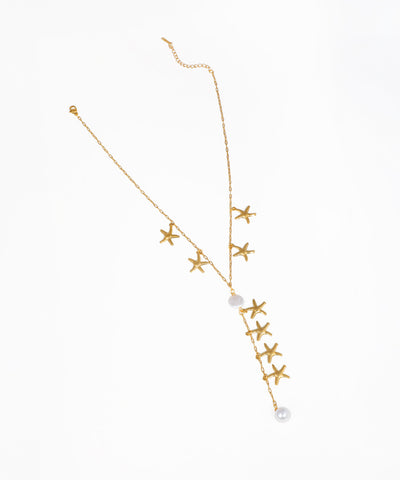 Gold-tone necklace with starfish charms and faux pearls in a lariat Y-drop design