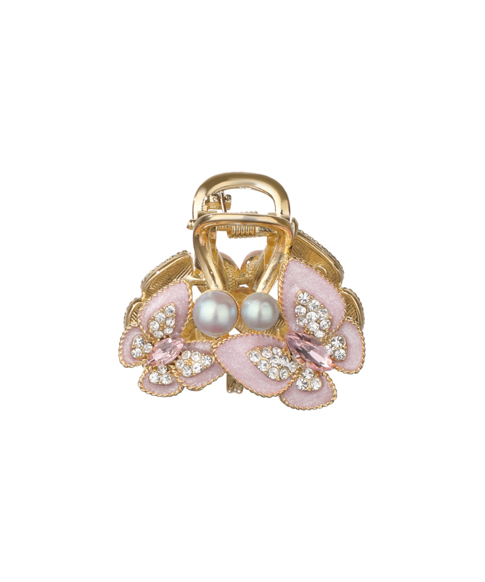 Gold-tone hair claw clip with pink floral accents, faux pearls, and clear and pink cubic zirconia details.