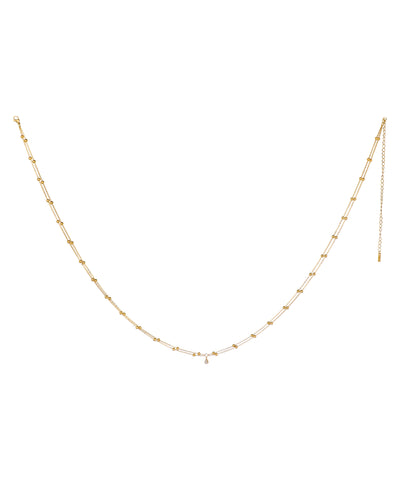 Gold-tone waist chain with double beaded layers and a single tear-drop CZ stone drop