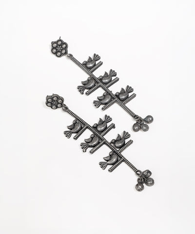 Oxidised finish earrings with folk bird and branch design, featuring small decorative ghungroos and a floral stud.