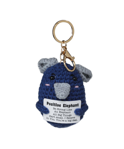 Gold-tone keychain with blue crochet elephant holding a positive message