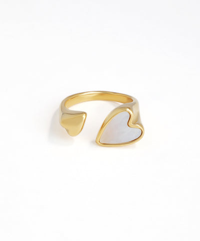 Gold-tone open ring with one polished heart and one pearlescent inlay heart design.