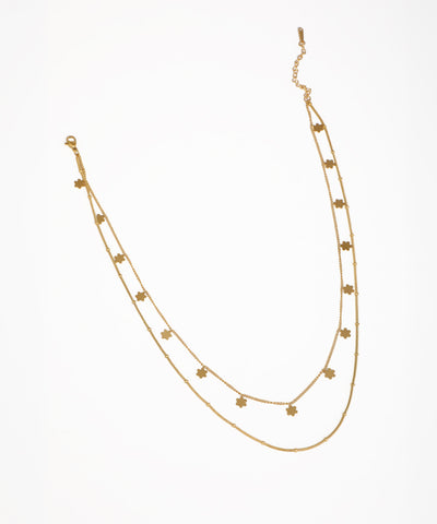 Gold-tone necklace with layered chains and small floral charms