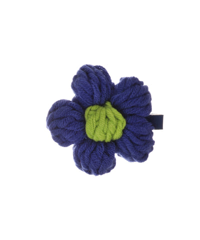 Blue and green crochet flower hair clip with textured yarn petals and center