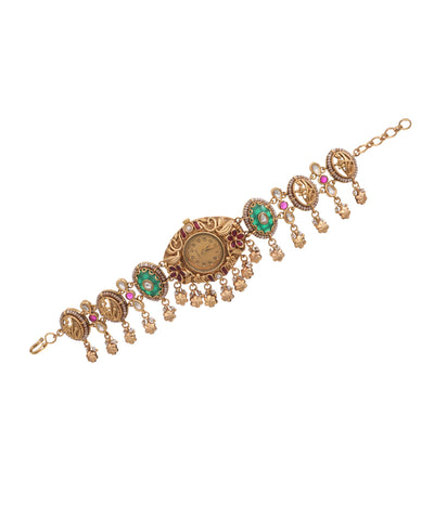 Antique gold-tone heritage watch with green and red stones, faux pearls, and small dangles.
