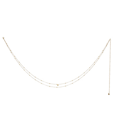Gold-tone waist chain with delicate beads and small heart charm